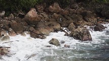 Waves crashing into rocks in the Caribbean.
