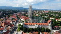 Aerial shot drone ascends and pans down over Cathedral of Zagreb in Croatia