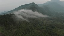 Fog Covered The Forested Mountains Near Lake Atitlan In Guatemala. aerial	
