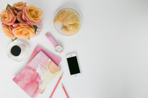 pink and peach roses, notes, watercolor, spring, coffee, watch, croissant, iPhone, pencil, white background 