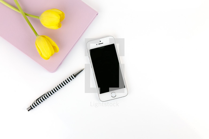 cellphone, iPhone, yellow, tulips, spring, journal, notebook, white background, pen, desk 