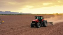 Tractor working in dry field in southern New Mexico