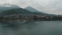 Santiago Town At The Shore Of Lake Atitlan Amidst The Volcanoes In Guatemala. aerial	