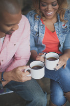 African American couple drinking coffee together 