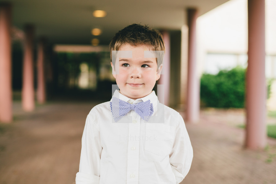a little boy in a bow tie 