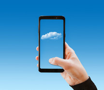 Cloud technology concept, hand touch on mobile phone, business connectivity with copy space.