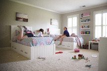 teens in a bedroom talking 