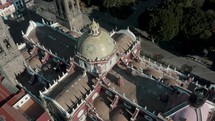 Aerial tilt down shot over famous Roman Catholic church Puebla Cathedral in Mexico	