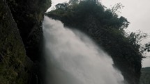 Powerful Water Cascade Of Devil's Cauldron In Baños de Agua Santa, Ecuador - low angle