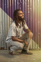  jamaican man with dreadlocks looking up to God 