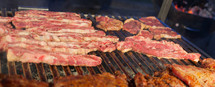Grilled meat on a hot grill. Specialty meat sold as street food.