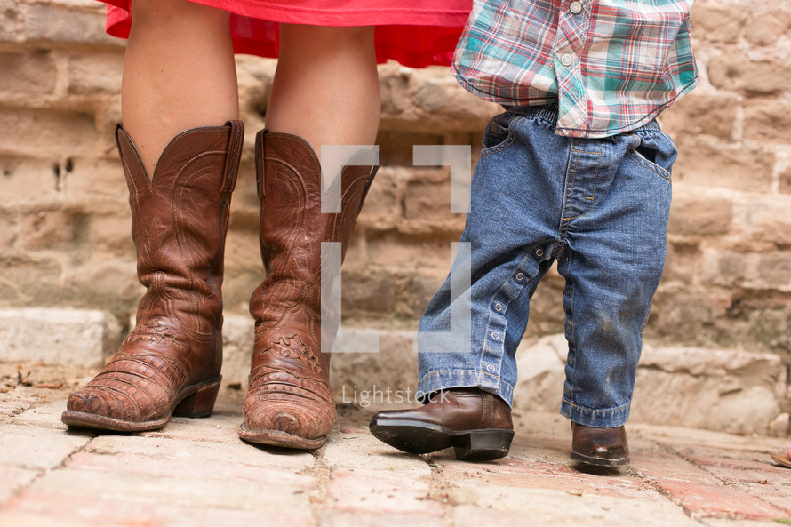 A Mom and Son wearing cowboy boots