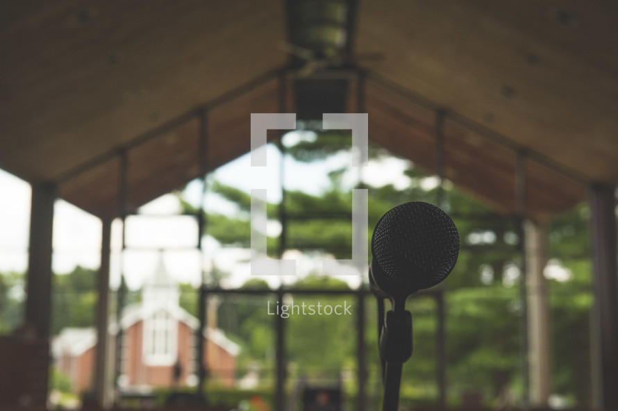 microphone in front of church windows 