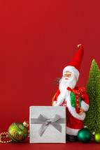 Santa figurine and Christmas gift 