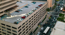 cars parked at the top of a parking deck 