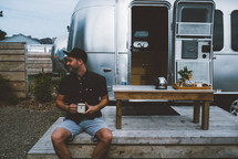 slow brew coffee in the morning by a camper 