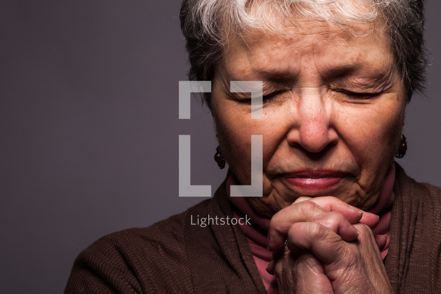 headshot of a woman in prayer
