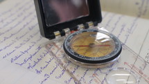 a compass on a letter 
