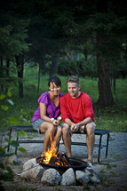couple roasting marshmallows 
