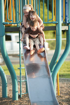 children on a slide 