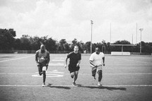 men running at a sports practice