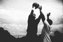 Men playing basketball.
