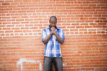 an African-American man praying 