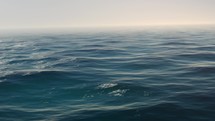 CGI Of Calm Blue Waves On A Misty Morning. Seamless Loopable Animation