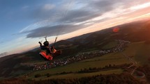 Calm Paragliding Fly at Sunset

