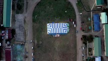 drone flying over an outdoor tent setup for a worship service in the Philippines 