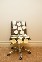 Sticky notes on a chair	