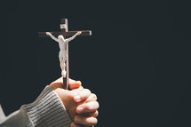 Hands holding a crucifix