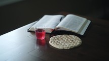 communion elements and opened Bible 