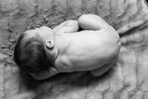 naked newborn on a blanket