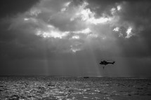 Rescue helicopter flying over water