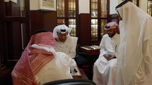 Qatari locals playing Al Dama at Souq Waqif in Doha Qatar. Majlis Al Dama council interior
