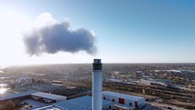 Smoke Bellows From an Industrial Chimney Contributing To Climate Change
