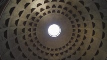 Rome Italy Pantheon dome footage panning around the oculus showing the sky and the dome roof this concrete coffered dome is poured into moulds the building is a popular tourist attraction in Rome