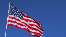 American flag against a blue sky 