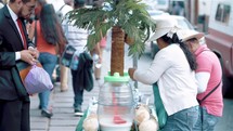 women selling coconut milk in Mexico 