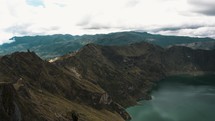 Hiking Path Along The Quilotoa Loop Around The Volcanic Crater Lake In Ecuador - aerial drone shot	