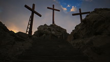 A sunny, beautiful sunrise/sunset at Golgotha on Easter morning featuring three crosses.