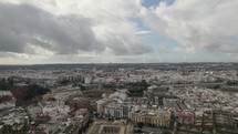Seville cityscape panoramic view, flying towards Guadalquivir riverside, Andalusia. Spain