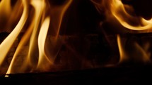 Fire wood, nice piece of wood burning in close-up and slow motion