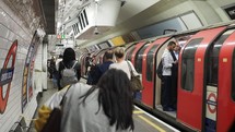 LONDON, UK: People waiting for the train at a London tube station platform