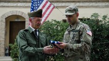 Military Veteran Receives Flag Folded by Cadet to Commemorate Memorial Day