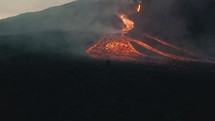 Lava rivers from Pacaya volcano eruption in Guatemala. Drone aerial sunrise shot	