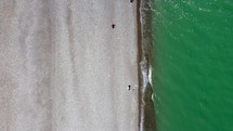 Sea waves on the beach top aerial view