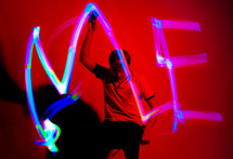 man making the word me in lights