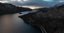 Drone footage of a road along Loch Lomond in Scotland.